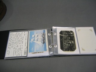 A green plastic album containing various black and white and colour postcards of liners and ships