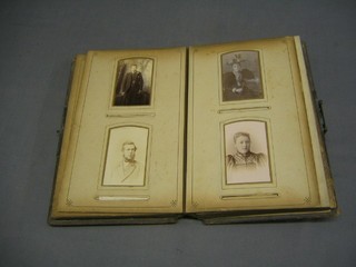 A Victorian leather bound family photograph album containing various portrait photographs (album spine missing)