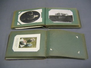 2 small albums of coloured postcards