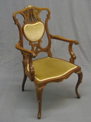 A handsome Edwardian inlaid mahogany open arm chair with pierced splat back and upholstered seat, raised on cabriole supports (light chip above right hand cabriole support)