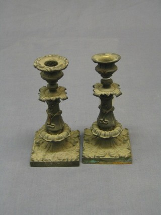 A pair of 19th Century gilt Ormolu candlesticks raised on square bases, 7" (1 sconce missing) 