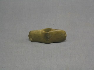 An ancient stone axe head 4"