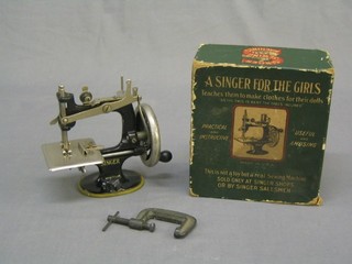 A childs Singer manual sewing machine