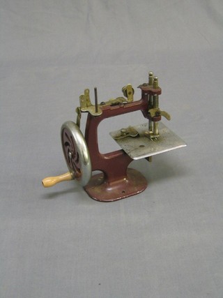 A child's metal framed sewing machine