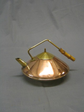 A Dutch Dresser style copper and brass kettle