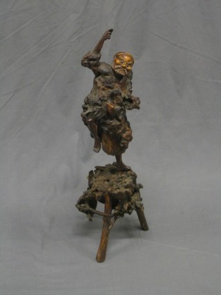 A 19th Century carved root wood figure of an Eastern gentleman 27"