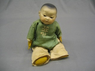 A 19th Century Armand Marseille porcelain headed doll "Chinese Baby" with opening eyes (f, slight chip to right eye), head incised AM Germany 351372