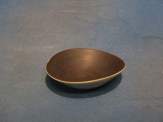 Dame Lucie Rie an oval Art Pottery bowl with white glazed exterior and brown glazed interior, 5"