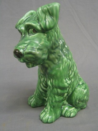A green glazed Sylvac pottery dog, base marked 1380, (head restored) 10"