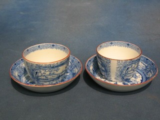A pair of 18th/19th Century Continental pottery tea bowls and saucers with blue and white transfer decoration depicting landscape (1 with chip to rim)