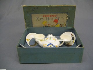 A 9 piece tea set with teapot, 2 cups and 2 saucers (1 cracked), 2 plates and sugar bowl, boxed