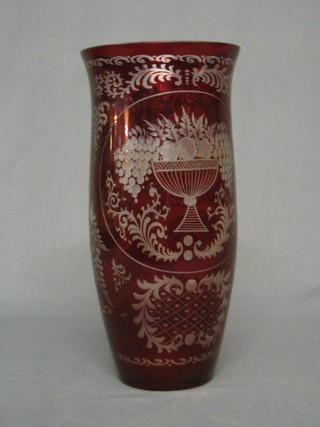 A red Bohemian etched glass vase decorated a vase of flowers 10" 