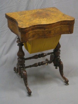 A handsome Victorian shaped and inlaid walnut work table, the flap over top inlaid a chess, backgammon and cribbage board of serpentine outline, the base fitted a drawer with deep basket, raised on a bulbous turned column united by an H framed stretcher, 22" (2 slight old blemished to front left hand top)