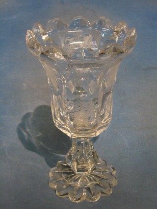 A 19th Century etched and faceted glass vase, raised on a shaped foot (chip to top and base) 10"