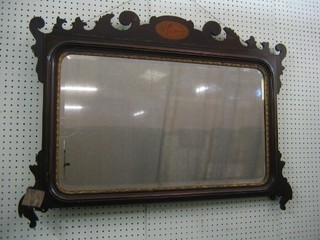 A rectangular Chippendale style plate mirror contained in a mahogany frame 36"