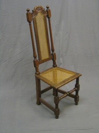 A 17th Century style walnut high back chair with cane seat and back