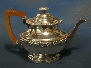 A Georgian style circular silver plated teapot with cast borders