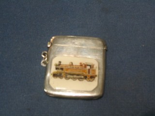 An Edwardian plain silver vesta case, London 1912 with later panel decorated a tank engine