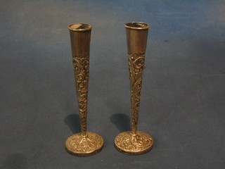 A pair of Victorian embossed silver specimen vases, raised on circular spreading feet London 1899 6"