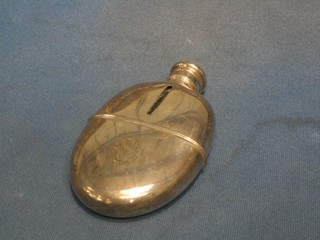 A 19th Century silver plated hip flask with detachable cup, monogrammed