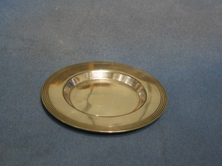 A circular silver plated patent, 5"