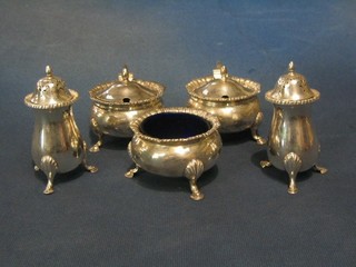 A handsome 5 piece silver condiment set comprising pair of mustard pots, pair of peppers and salt, Birmingham 1926 by Mappin Webb (1 blue glass liner missing from mustard) 17 ozs