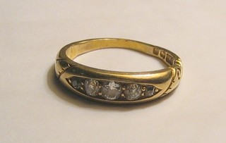 A lady's 18ct gold dress ring set 5 diamonds