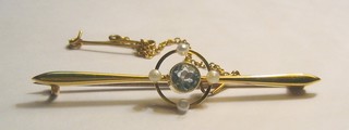 A 15ct gold bar brooch set a circular cut aquamarine supported by 4 demi-pearls