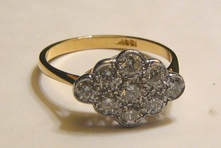 A lady's 18ct gold dress ring set 9 diamonds (0.86ct)