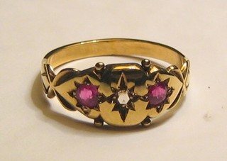 A lady's gold dress ring set a diamond and 2 rubies