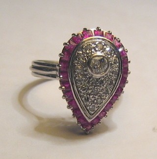 A lady's 18ct white gold dress ring of heart design, set diamonds and rubies