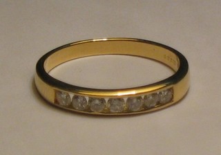 A lady's 18ct yellow gold half eternity ring set 7 diamonds