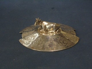 A circular Victorian engraved silver butter dish lid, the finial in the form of a seated cow, London 1870 4"
