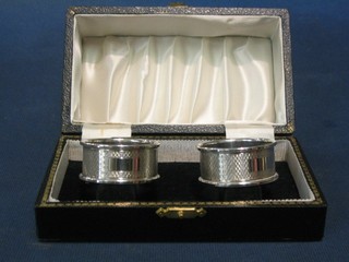 A pair of silver napkin rings Birmingham 1968, cased