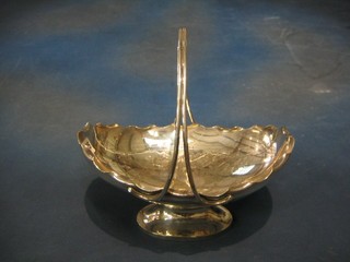 An oval engraved silver plated cake basket by Mappin & Webb