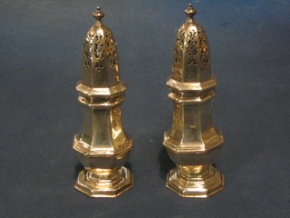 A pair of Georgian style octagonal silver peppers Birmingham 1924 5"