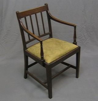 A 19th Century mahogany stick and bar back desk chair with upholstered drop in seat, raised on square tapering supports