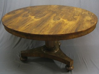 A handsome Victorian rosewood circular snap top breakfast table, raised on a chamfered column with triform base and bun feet 53"