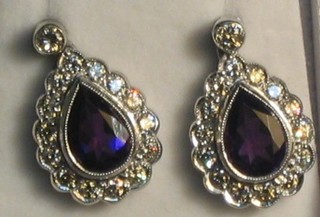 A pair of tear shaped drop earrings set amethysts and diamond  (approx 1.32ct)