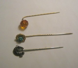 A gold and turquoise set stick pin and 2 others
