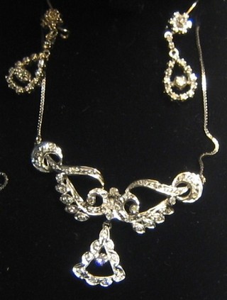 A lady's attractive 18ct white gold necklace set diamonds together with a pair of matching earrings
