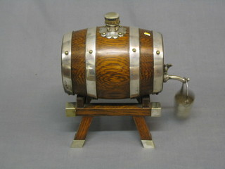 An oak spirit barrel with silver plated mounts