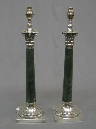 A pair of marble finished and silver plated table lamps with Corinthian capitals