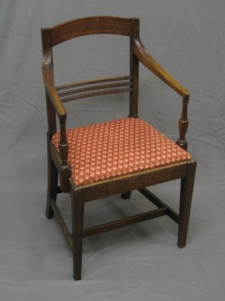 A 19th Century mahogany bar back dining chair with mid rail and upholstered drop in seat, on square tapering supports