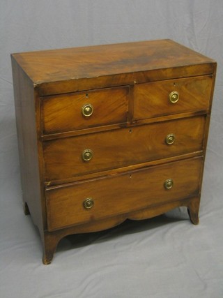 A Georgian mahogany chest of 2 short and 2 long drawers with ring neck drop handles and crossbanded top, raised on bracket feet 32" (missing 1" of veneer to right hand corner)