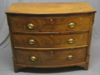 A Georgian mahogany bow front chest of 3 long drawers with brass swan neck handles and escutcheons, raised on bracket feet 43"