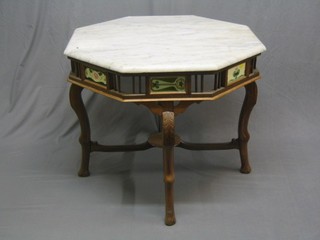 A 20th Century Anglo Eastern octagonal hardwood table with white veined marble top, the apron with pierced and tiled decoration, raised on carved cabriole supports 36" (top cracked)