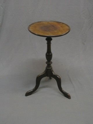 A circular Georgian style wine table raised on pillar and tripod supports 14"