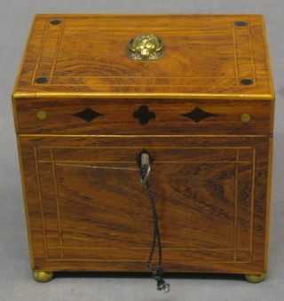 A 19th Century inlaid mahogany  tea caddy, the top inlaid satinwood stringing and with brass lion mask handles, raised on 4 brass feet 5 1/2"