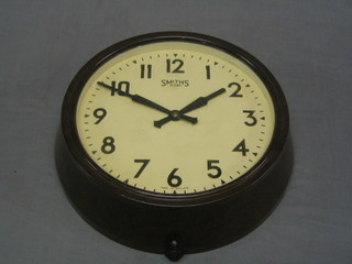 A 1930's 8 day wall clock by Smiths with 9" dial contained in a Bakelite case